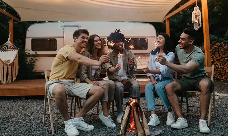 friends camping with sparklers
